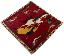 Corner detail of 2000s Shiraz rug showing border pattern and Wool pile