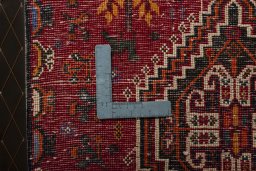 Backside of handmade 2000s Shiraz rug showing knot structure and weave density