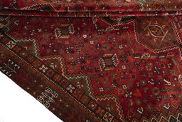 Full view of 1970s Shiraz rug from Iran / Persia, 295 × 210 cm in Red tones