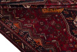 Full view of 1970s Shiraz rug from Iran / Persia, 300 × 194 cm in Red tones