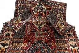 Corner detail of 1970s Shiraz rug showing border pattern and Wool pile
