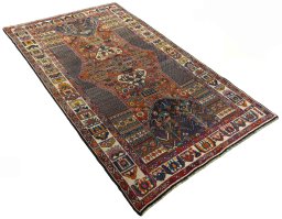 Close-up detail of 1970s Shiraz rug from Iran / Persia showing Wool weave