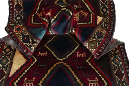Corner detail of 2000s Shiraz rug showing border pattern and Wool pile