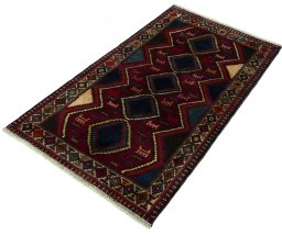 Corner detail of 2000s Shiraz rug showing border pattern and Wool pile