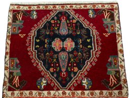 Surface texture of 2000s Shiraz rug with natural Wool and intricate pattern