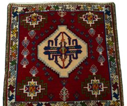 Surface texture of 2000s Shiraz rug with natural Wool and intricate pattern
