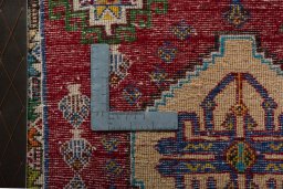 Backside of handmade 2000s Shiraz rug showing knot structure and weave density
