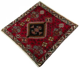Corner detail of 2000s Shiraz rug showing border pattern and Wool pile