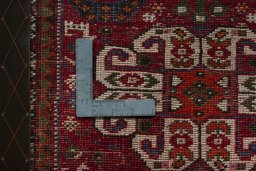 Backside of handmade 2000s Shiraz rug showing knot structure and weave density