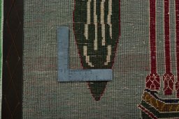 Backside of handmade 2000s Shiraz rug showing knot structure and weave density