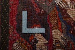 Backside of handmade 2000s Shiraz rug showing knot structure and weave density