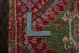 Backside of handmade 2000s Shiraz rug showing knot structure and weave density