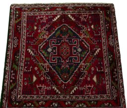 Surface texture of 2000s Shiraz rug with natural Wool and intricate pattern
