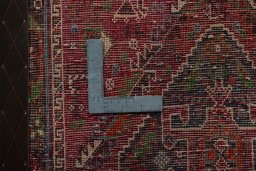 Backside of handmade 2000s Shiraz rug showing knot structure and weave density