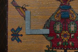 Backside of handmade 2000s Shiraz rug showing knot structure and weave density