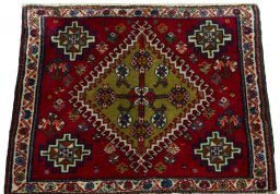 Surface texture of 2000s Shiraz rug with natural Wool and intricate pattern
