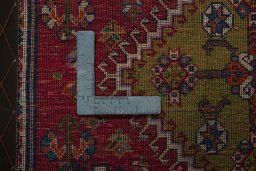 Backside of handmade 2000s Shiraz rug showing knot structure and weave density
