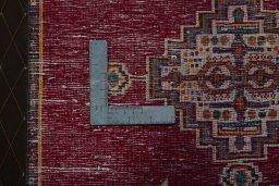 Backside of handmade 2000s Shiraz rug showing knot structure and weave density