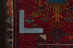 Backside of handmade 2000s Shiraz rug showing knot structure and weave density