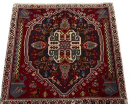 Surface texture of 2000s Shiraz rug with natural Wool and intricate pattern