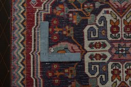 Backside of handmade 2000s Shiraz rug showing knot structure and weave density