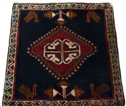 Surface texture of 2000s Shiraz rug with natural Wool and intricate pattern