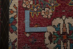 Backside of handmade 2000s Shiraz rug showing knot structure and weave density