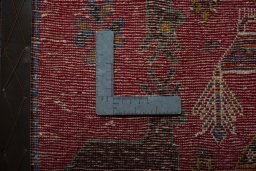 Backside of handmade 2000s Shiraz rug showing knot structure and weave density