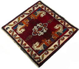 Corner detail of 2000s Shiraz rug showing border pattern and Wool pile
