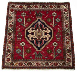 Surface texture of 2000s Shiraz rug with natural Wool and intricate pattern