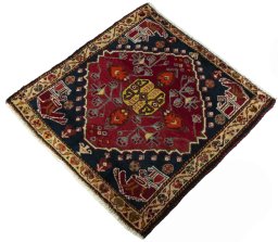 Corner detail of 2000s Shiraz rug showing border pattern and Wool pile