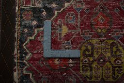 Backside of handmade 2000s Shiraz rug showing knot structure and weave density