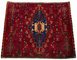 Surface texture of 2000s Shiraz rug with natural Wool and intricate pattern