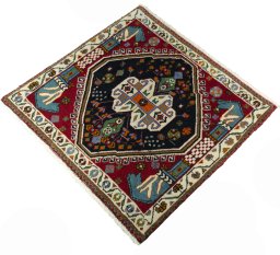 Corner detail of 2000s Shiraz rug showing border pattern and Wool pile