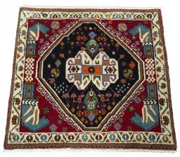 Surface texture of 2000s Shiraz rug with natural Wool and intricate pattern