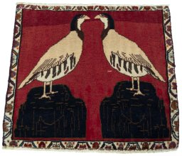 Surface texture of 2000s Shiraz rug with natural Wool and intricate pattern