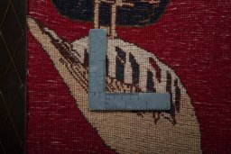 Backside of handmade 2000s Shiraz rug showing knot structure and weave density