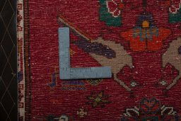 Backside of handmade 2000s Shiraz rug showing knot structure and weave density
