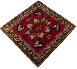 Corner detail of 2000s Shiraz rug showing border pattern and Wool pile