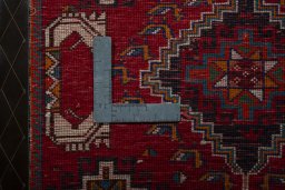 Backside of handmade 2000s Shiraz rug showing knot structure and weave density