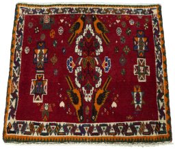 Surface texture of 2000s Shiraz rug with natural Wool and intricate pattern
