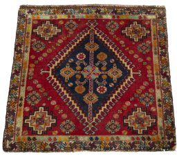 Surface texture of 2000s Shiraz rug with natural Wool and intricate pattern