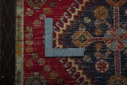 Backside of handmade 2000s Shiraz rug showing knot structure and weave density