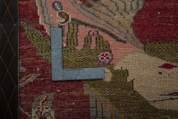 Backside of handmade 2000s Shiraz rug showing knot structure and weave density