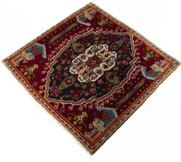 Corner detail of 2000s Shiraz rug showing border pattern and Wool pile