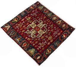 Corner detail of 2000s Shiraz rug showing border pattern and Wool pile