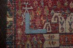 Backside of handmade 2000s Shiraz rug showing knot structure and weave density