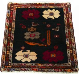 Surface texture of 2000s Shiraz rug with natural Wool and intricate pattern