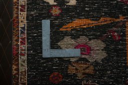 Backside of handmade 2000s Shiraz rug showing knot structure and weave density