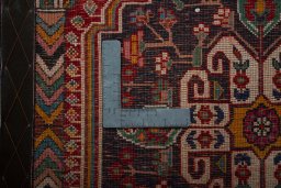 Backside of handmade 2000s Shiraz rug showing knot structure and weave density